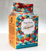 Honeysuckle Soy Wax Candle by Song of India — candle fragrance and label detail