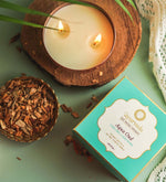 Aqua Oud Scented Candle by Song of India — soy wax candle jar and packaging detail